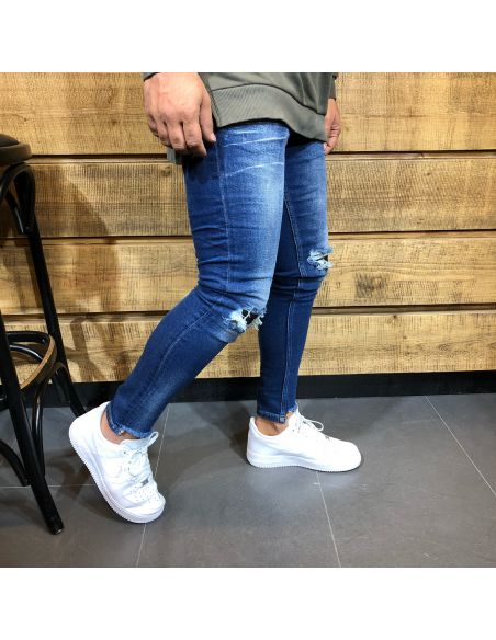 Jeans bleu à la mode pour hommes avec des coupes