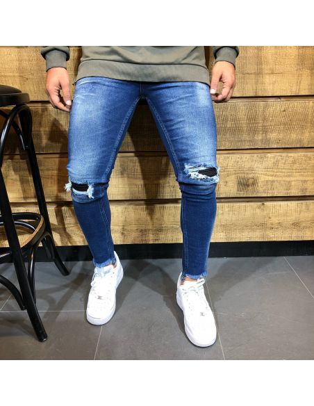 Jeans bleu à la mode pour hommes avec des coupes