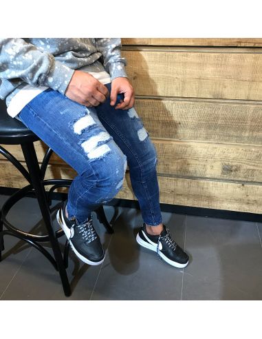 Jeans bleu à la mode pour hommes avec des coupes